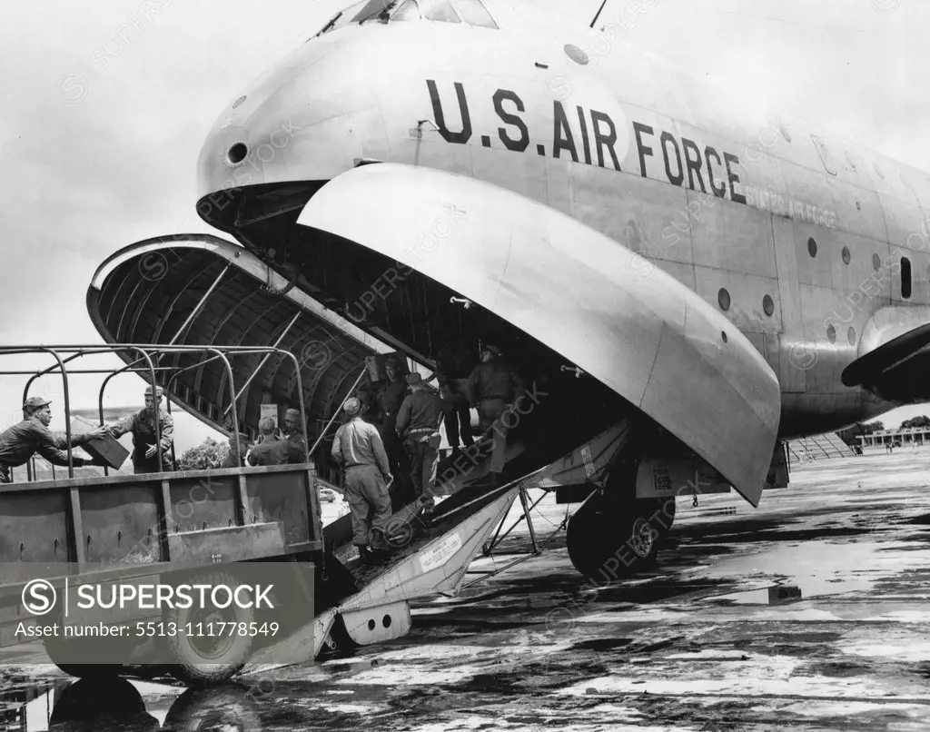 U.S. Air Force C-124 Globemaster is Unloaded in Flood-Stricken East Pakistan The first U. S. Air Force C-124 Globemaster of the Far East Air Forces' 374th Troop Carrier Wing, from Tachikawra Air Installation near Tokyo, Japan, to land at Dacca, East Pakistan, Aug. 16, is unloaded by U. S. Army personnel of the 37th Medical Preventive Medicine Company. United States aid, in the form of medical supplies and personnel, was airlifted to East Pakistan to assist the 7,000,000 flood victims isolated by