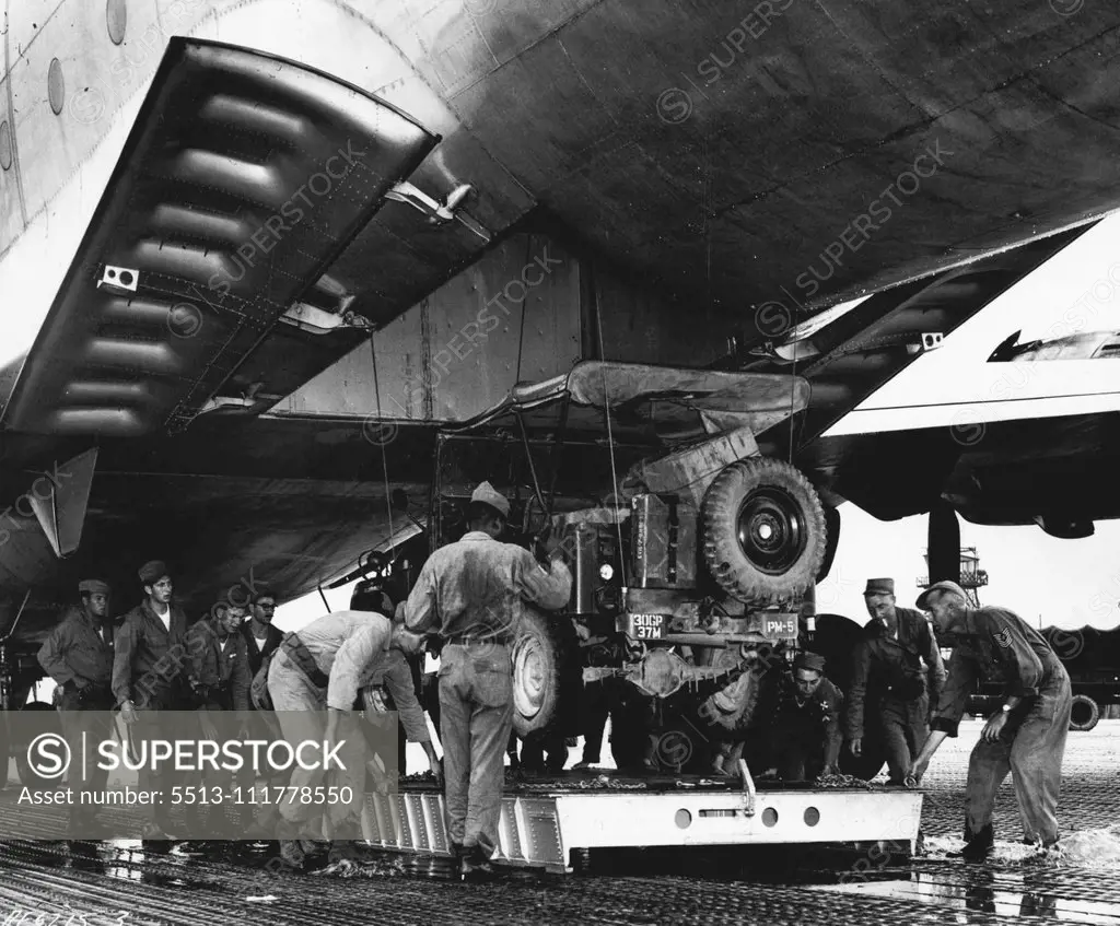 United States Mercy Mission To East Pakistan Loaded In Korea U. S. Air Force end Army personnel load a jeep aboard one of eight C-124 Globemasters which left recently with United States aid to flood-stricken East Pakistan. In the joint Air Force-Army mission, 40 members of the Army's 37th Medical Preventative Medicine Company and tons of medical supplies and equipment are being airlifted to the flood victims. The Globemaster crews include extra pilots, who will alternate at the controls in order