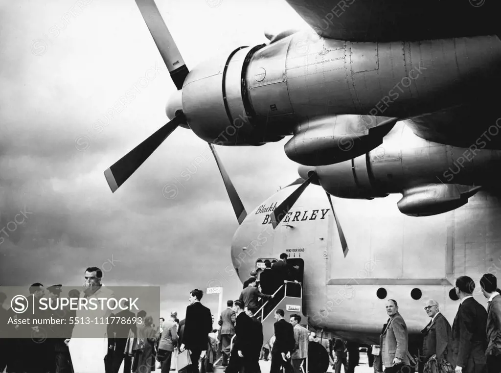 Farnborough Air Show -- Visitors to the show entering the giant Blackburn Beverley freighter which is powered by four Bristol Centaurus piston engines. The Flying Display and exhibition of British Aircraft opened at Farnborough today. September 06, 1954. (Photo by Barratt's).