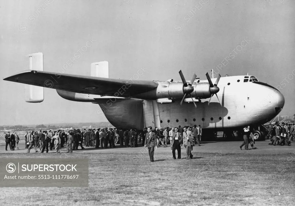 Flying Display And Exhibition Opens At Farnborough -- One of the "giants of the air" on show at Farnborough today - the Blackburn and General Aircrafts, Ltd. Prototype Beverley a freighter, in which interest is obvious by the crowds queuing to inspect it. Large crowds today attended the opening of the 1953 Flying Display and Exhibition, a "Shop window" for the products of the members of the Society of British Aircraft Constructors, at Farnborough Aerodrome, Hants. September 07, 1953. (Photo by F