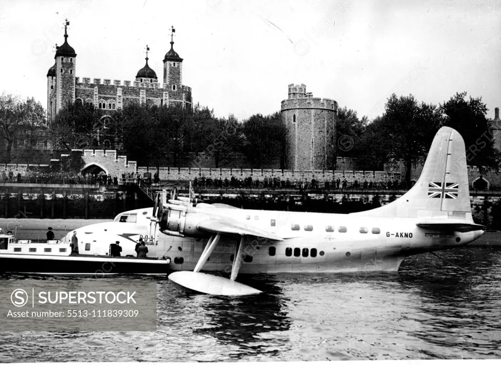 Flying Boat Moored on Thames. Moored at Tower Pier with the Tower of London in the background. The London Thames carried a different boat yesterday this 35-ton Short Solent, largest of Britain's commercial flying boats. The Solent, first flying boat to land in the London area for twenty-one years, touched down at Limehouse Reach and taxied up the river through the Tower Bridge. The bridge was raised to make sure the Solent's high tall did not foul it. She was finally moored near Tower Bridge. Ma
