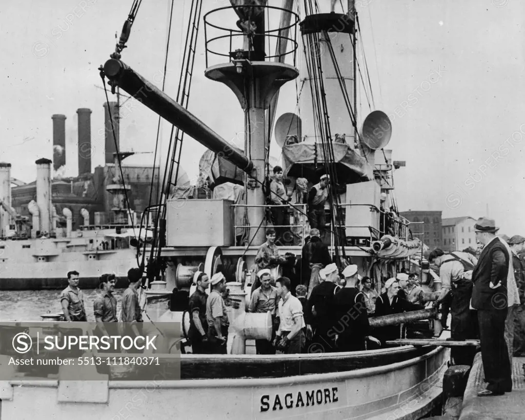 Aid For Sunken Sub Crew Rushed From New York -- Navy men loading equipment aboard the U.S. Navy tug Sagamore at the Brooklyn Navy Yard today as the Sagamore was readied for a trip to Portsmouth, N.H., southeast of which the submarine Squalus sank today. The Sagamore was towing pontoons and carrying other equipment which she used in rescue work when the S-4 sank off Provincingtown, Mass. May 23, 1939. (Photo by by Wide World Photo).