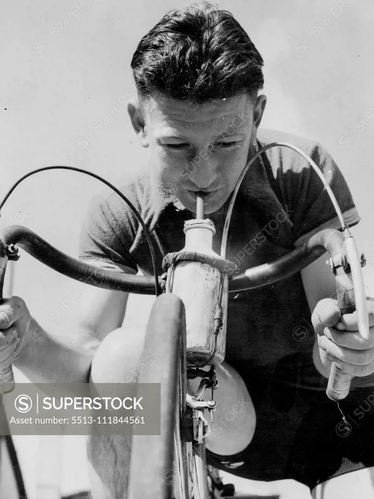 Here's One for The Road - Alpine Tour record-breaker, W. King, cools the inner man just before the start of the 140-mile Tour of Gippsland cycle race today. He went off the scratch mark in today's event. October 04, 1938.;Here's One for The Road - Alpine Tour record-breaker, W. King, cools the inner man just before the start of the 140-mile Tour of Gippsland cycle race today. He went off the scratch mark in today's event.