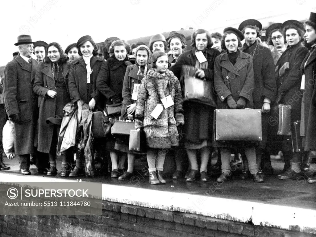 Jewish Refugee Children Arrive -- The refugee children photographed on arrival at Lowestoft yesterday showing the smallest arrival in centre in fur coat. Over 500 Jewish refugee children mostly from Vienna arrived at Lowestoft yesterday. They are being accommodated at the Pakefield holiday camp, Lowestoft. Their ages range from 10 to 17 years with the exception of one little girl who is 7 years of age. Their first real meal for two days consisted of kippers given by the Lowestoft herring Mercha