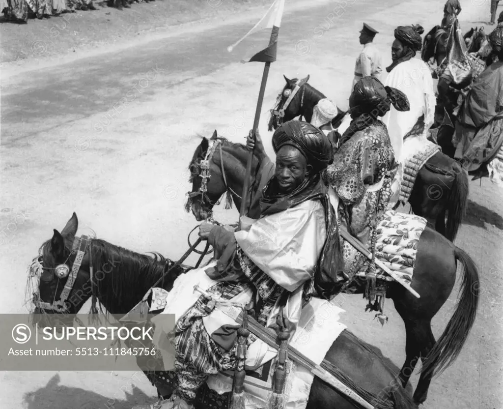 In magnificent apparel these warriors were among the 7,000 ian tribesman who paraded before the Queen at yesterday's (2-2-56) Durbar at Kaduna. February 17, 1955. (Photo by Daily Mirror).;In magnificent apparel these warriors were among the 7,000 ian tribesman who paraded before the Queen at yesterday's (2-2-56) Durbar at Kaduna.