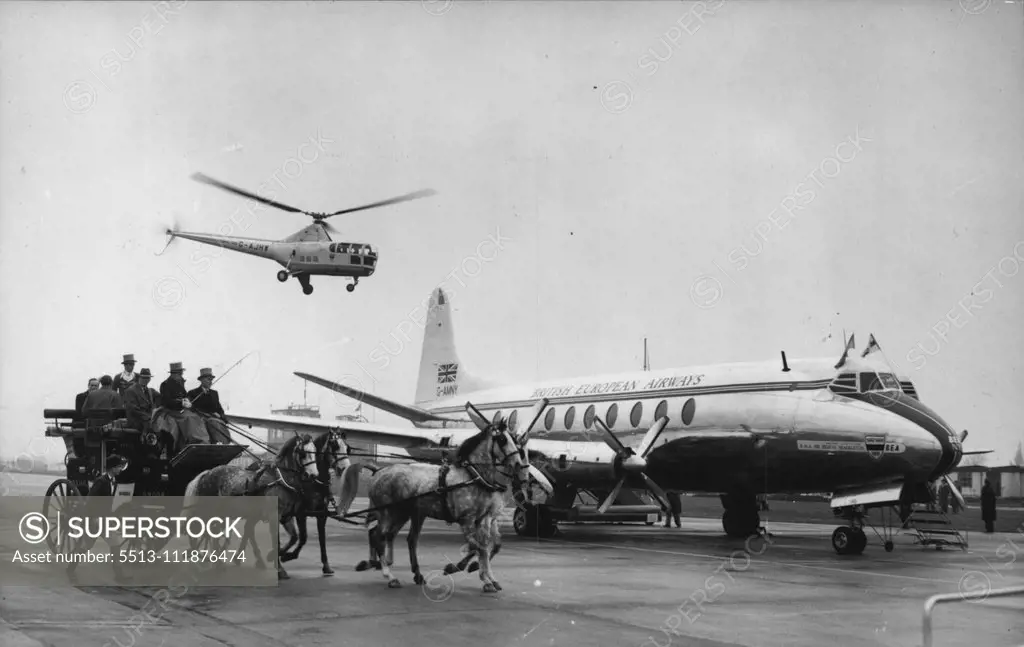 Viscount To Cyprus -- As the British European airways viscount airliner prepared to leave London this morning, 18 April, to make the world's first fare-paying flight in a jet-prop airliner, a stagecoach and helicopter were on the scene to add publicity to the enterprise. April 18, 1953. (Photo by Associated Press Photo). ;Viscount To Cyprus -- As the British European airways viscount airliner prepared to leave London this morning, 18 April, to make the world's first fare-paying flight in a jet-p