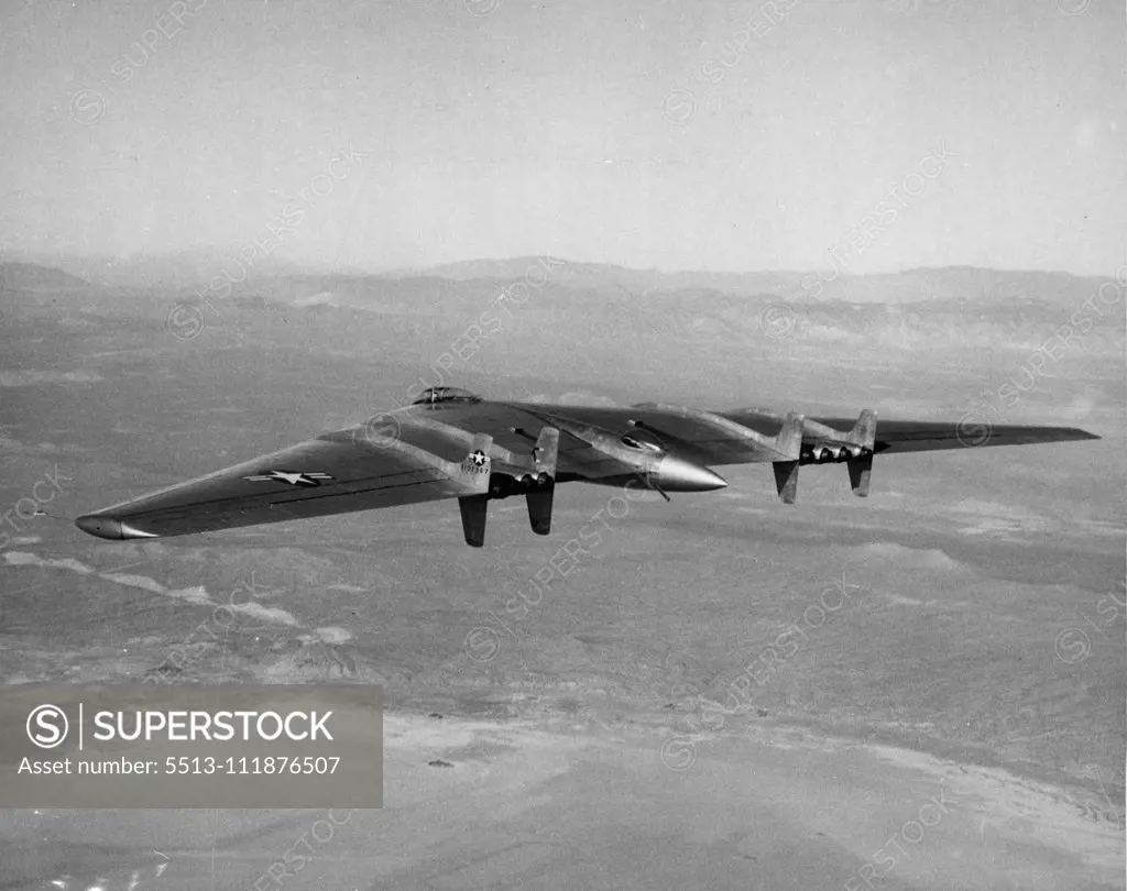 The first photo of the powerful Northrop Flying Wing YB-49 in flight shows the huge U.S. Air Forces bomber, longest-ranging jet airplanes in the world, knifing through the air high above the California desert. Currently undergoing tests at Muroc Army Air Field, the unconventional, but highly-efficient tailless craft is the world's most powerful airplane. Its eight jet engines provide the equivalent of 32,000 horse-power to thrust the 172-foot wing span craft through the air at undisclosed speeds