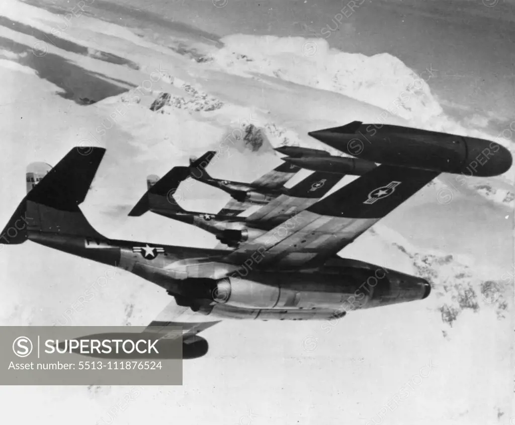 American Jets Roar Over Arctic -- Three U.S. Air Force Northrop Scorpion F89D all-weather interceptors fly in close formation over the frozen Arctic. Assigned to the 64th Fighter-Interceptor squadron at Elmendorf Air force Base, Anchorage, Alaska, these 600 mile an hour jets are part of the U.S. aerial defense fleet guarding the vital approaches to the United States against air attack. The planes are America's most heavily armed fighters. November 10, 1954. (Photo by AP Wirephoto).;American Jets