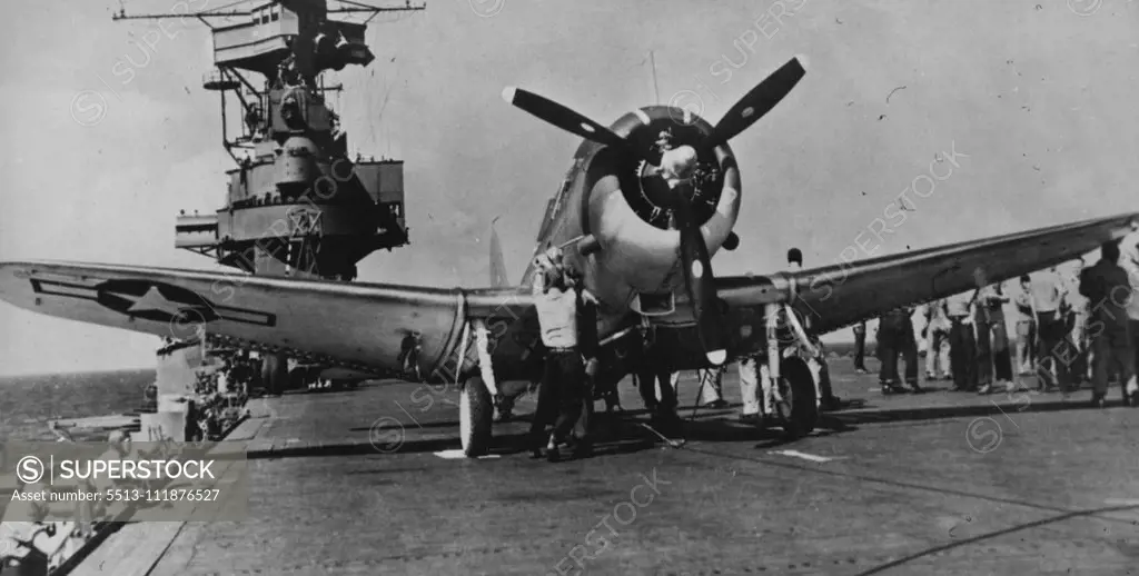 Navy dive/bomber prepared for mission against the Japanese in the Central Pacific on the flight deck of a Pacific Fleet aircraft carrier. March 17, 1944. (Photo by Official U.S. Navy Photograph). ;Navy dive/bomber prepared for mission against the Japanese in the Central Pacific on the flight deck of a Pacific Fleet aircraft carrier.