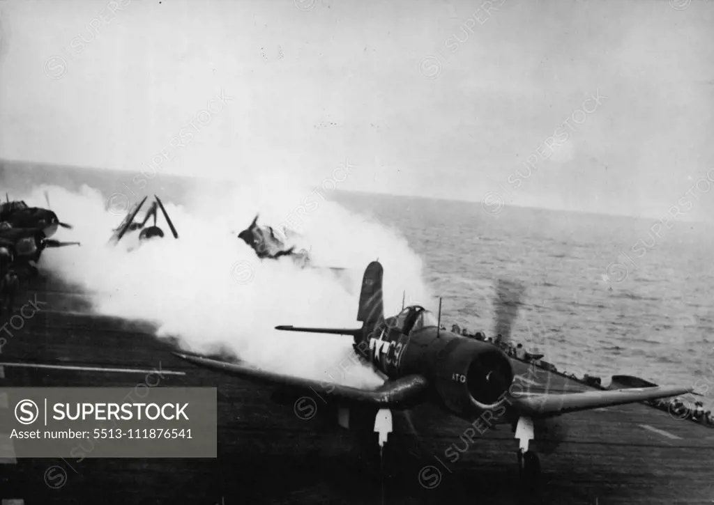 New Jet Units Help Carrier Plane Takeoff -- A U.S. Navy Corsair fighter plane, powered by both sides motor and by new jet propulsion units roars down the flight deck of a ***** for a takeoff. Spent gases from the units ***** in the plane's wake. The new jets reduce normal ***** off runs from 33 to 60 percent, help planes to ***** loads and enable carriers to handle more ***** on their flight decks. October 06, 1944.;New Jet Units Help Carrier Plane Takeoff -- A U.S. Navy Corsair fighter plane, p