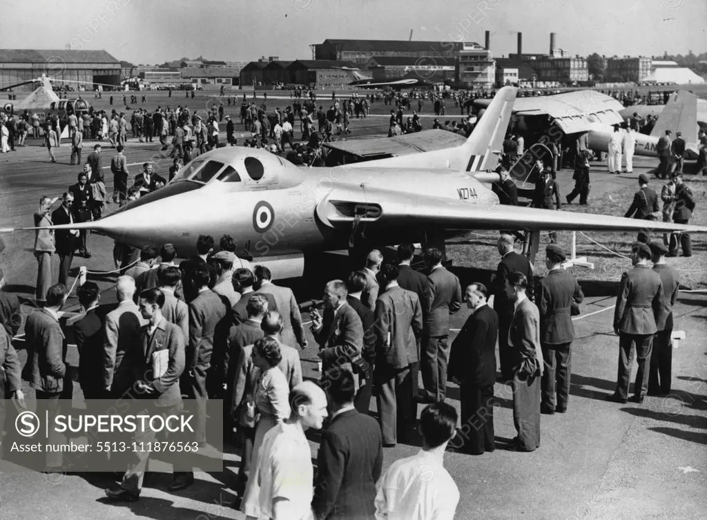 Flying Display And Exhibition Opens At Farnborough -- Crowds getting a close view of an Avro 707c on show at Farnborough today. Large crowds attended the 1953 Flying Display and Exhibition, a "shop window" for the products of the members of the Society of British Aircraft Constructors which opened today at Farnborough Aerodrome, Hants. September 7, 1953. (Photo by Fox Photos).;Flying Display And Exhibition Opens At Farnborough -- Crowds getting a close view of an Avro 707c on show at Farnborough