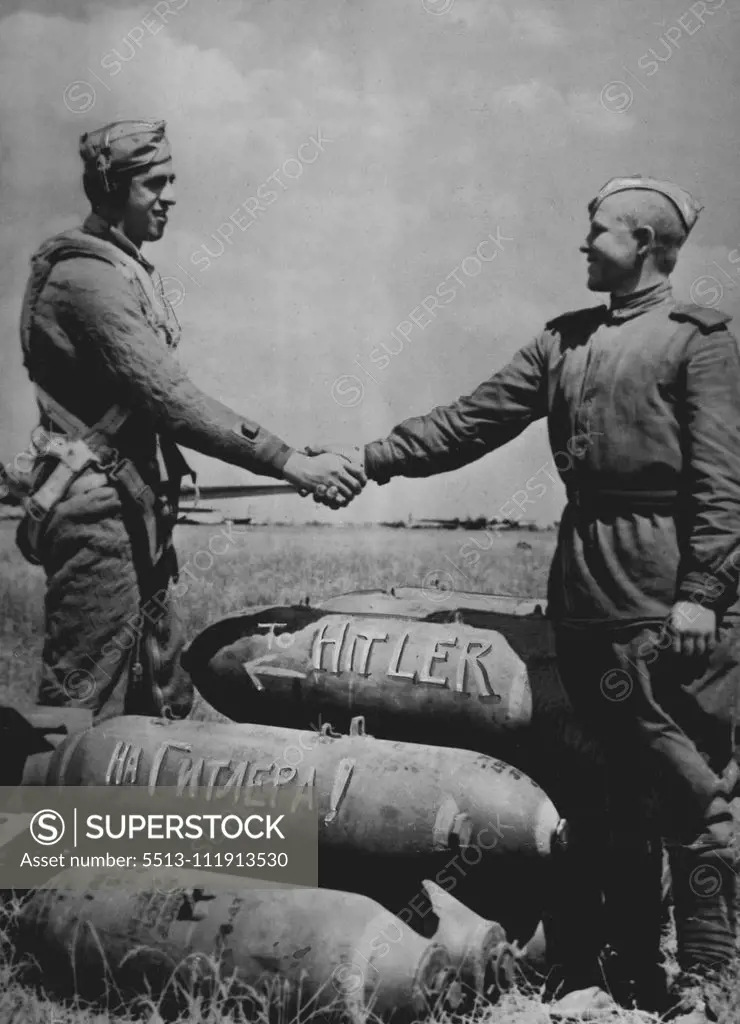 American And Russian Soldiers Shake Hands Over Bombs For The Enemy -- At an air base in Russia used by American aircraft, a U.S. and Red Army soldier shake hands over a pile of bombs addressed to the enemy. The Russian words "to Hitler" are painted on a bomb under one bearing the English spelling American aircraft have used bases in Russia since June 2, 1944, when Flying Fortresses left a base in Italy, bombed German targets in Rumania, and combined to new airfields in Russia prepared to receive