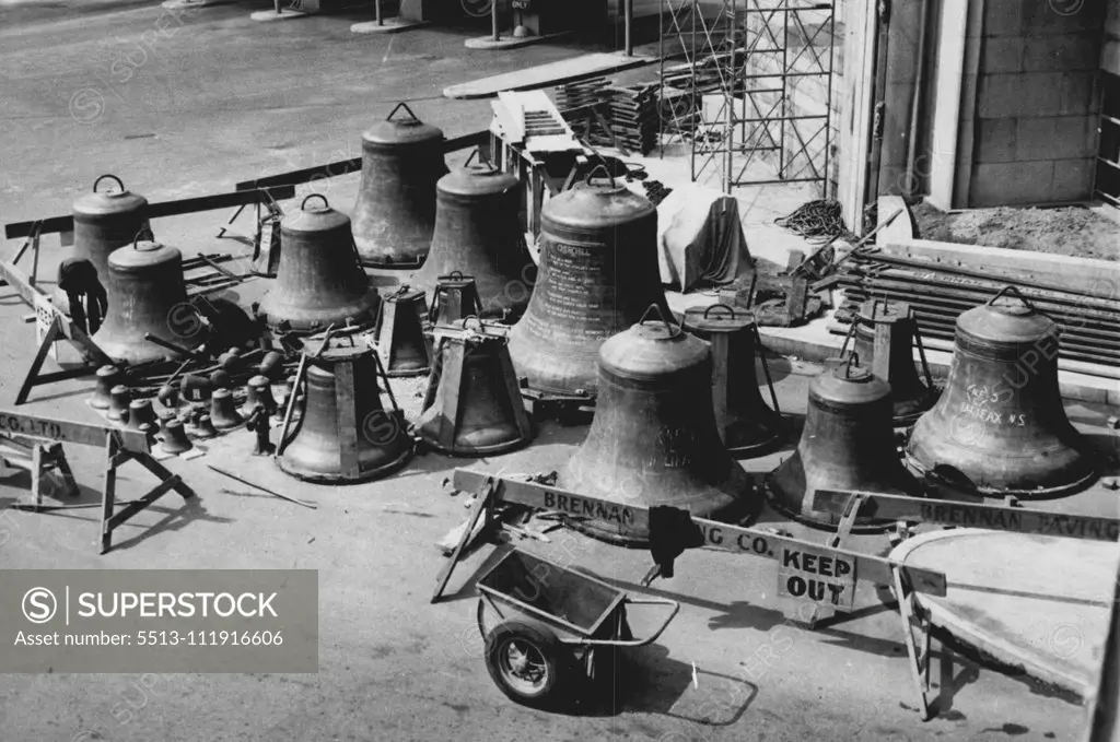 Carillon Bells Arrive -- Here workmen are shown, at left, completing the unloading of the 55 British made Carillon Bells. In the centre the ten ton Churchill bell can be seen. Synchronization of these chimes is so true that the slightest jar on the part of those transporting them could ruin their tune. November 4, 1947. (Photo by Wide World Photos).