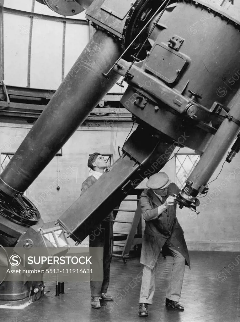 ***** Telescope Presented to Royal Observatory. The most ***** reflecting telescope ever installed at the Royal Observatory Greenwich. ***** there were so eager to bring TT into immediate *****, have been using it for several weeks before its formal hiding the donor, Mr. W.J. Yapp. The official acceptance of ***** took place on June 2nd., by the first lord of the admiraly, Sir Bolton Eyres - Monsell. Adjustments being made on the new telescope. July 01, 1934. (Photo by Sport & General Press Agen