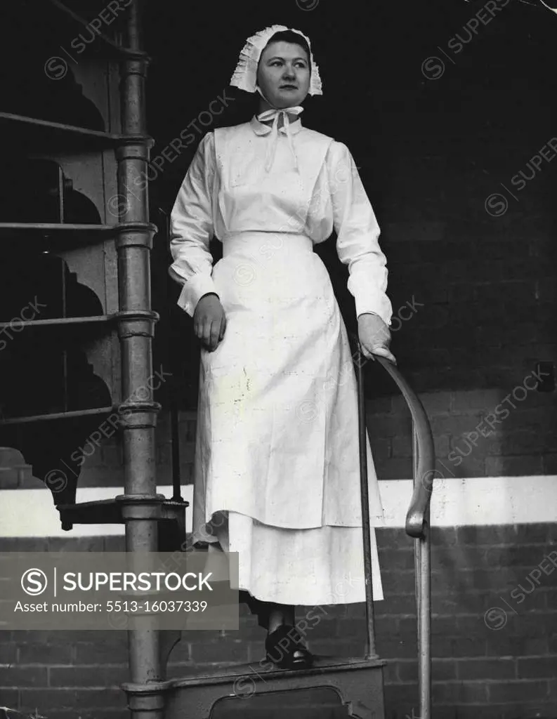 A trainee of Melbourne school of Nursing, wears frilled bonnet starched apron and long dress of 1904 period. Trainee Verna Blomquist models 1904 nurses's dress. September 2, 1955. 
