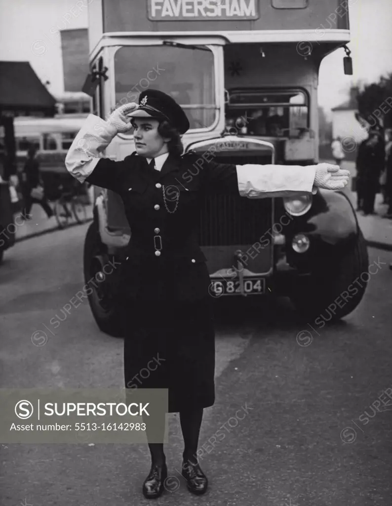 "New Look" In Old Canterbury A "new look" has come to the old-world city of Canterbury. Policewoman Joan Powis, is one of four policewomen who are performing traffic duty in the city's main street. The girls, ex-A.T.S and W.A.A.F's, maintain that they can carry out any police duties performed by men. February 26, 1949.