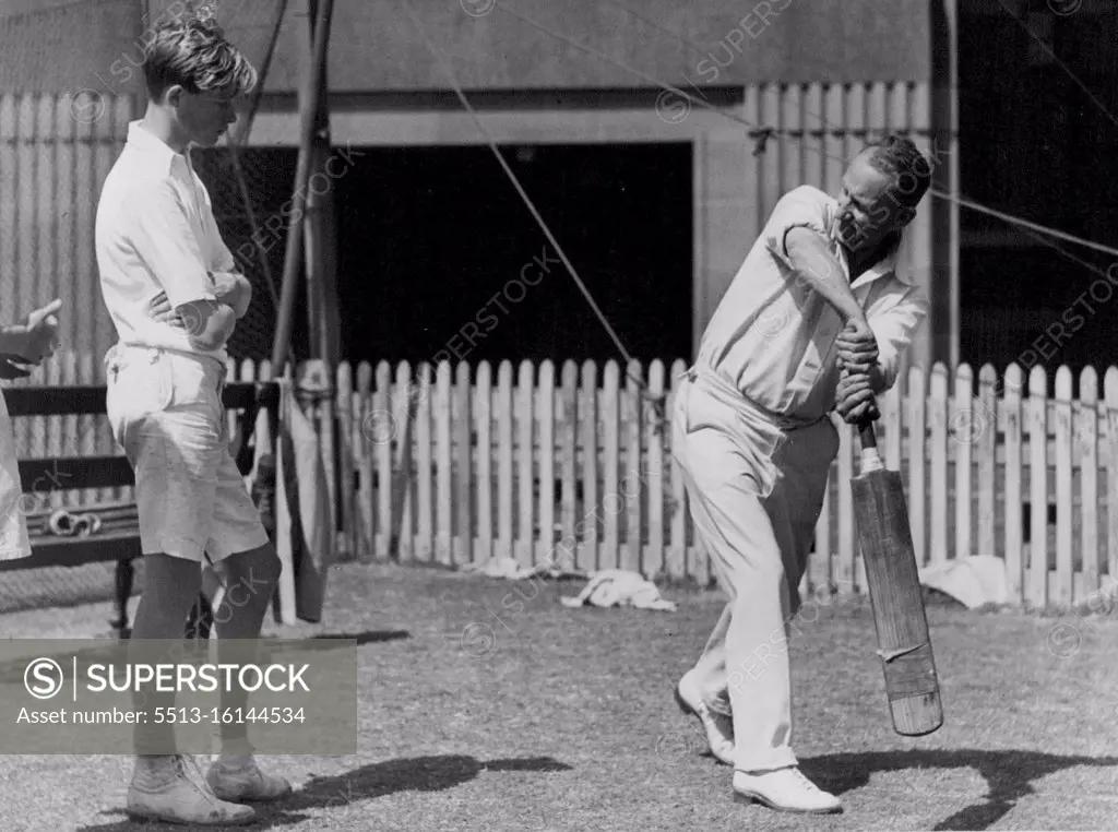 Geo Garnsey (Rgin) showing Ian ***** the carried way to Play a shot cricket coaching. S.C.G. October 22, 1945. 
