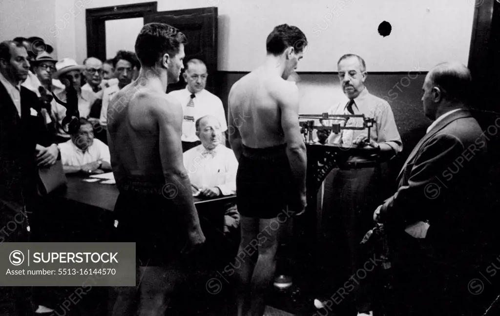 Weighing-time at the N.Y. State Athletic Commission is 12 noon. An official does the job. April 01, 1949.
