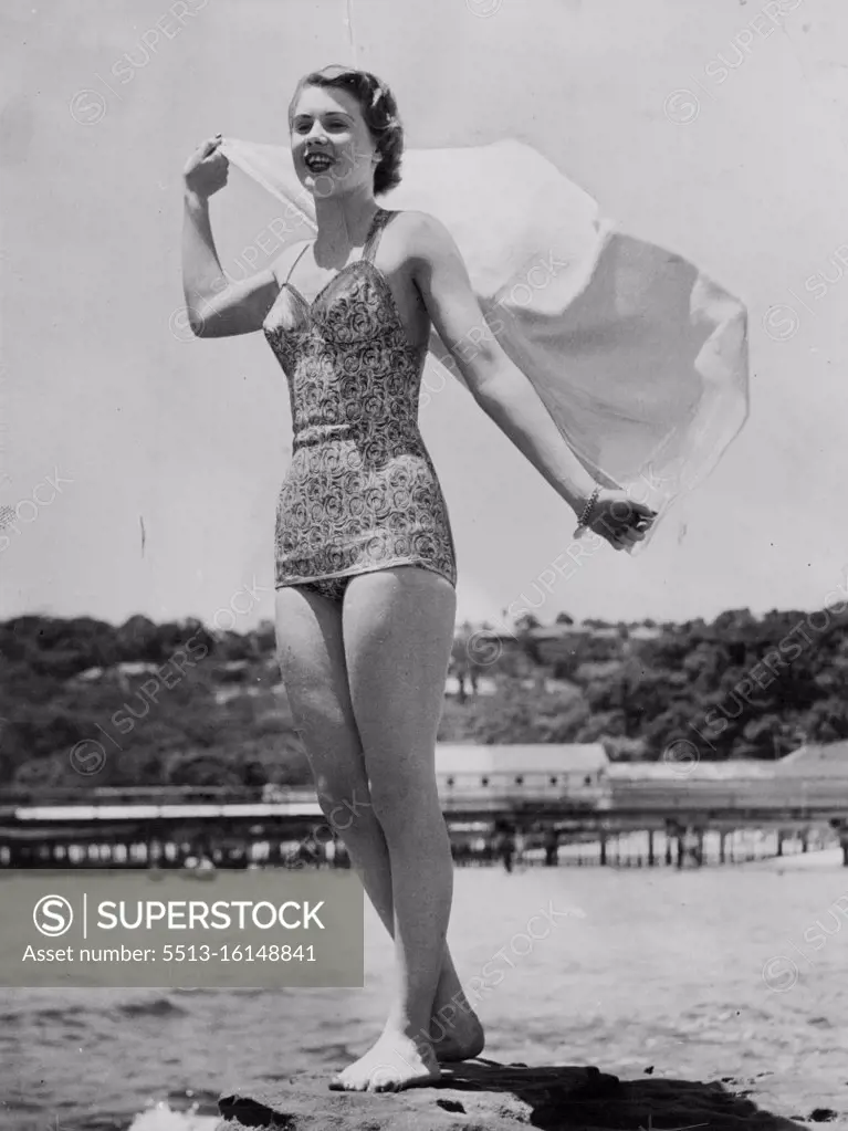 Lovely study of Miss NSW, Margaret Hughes, enjoying the sea breeze at Balmoral. December 5, 1949.