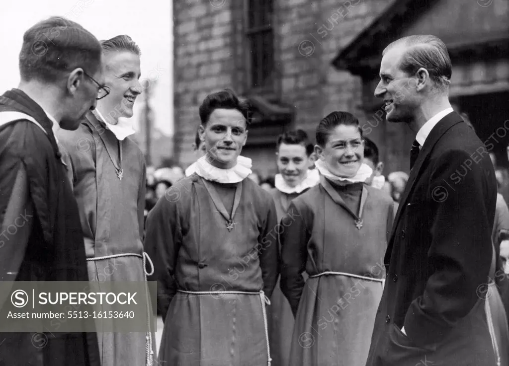 The Duke At Canongate Kirk. The Duke chatting to choir boys at the Canongate Kirk, Edinburgh. The Duke marked his visit by opening a new door and planting a tree in the Churchyard. June 29, 1953. (Photo by Paul Popper Ltd.).