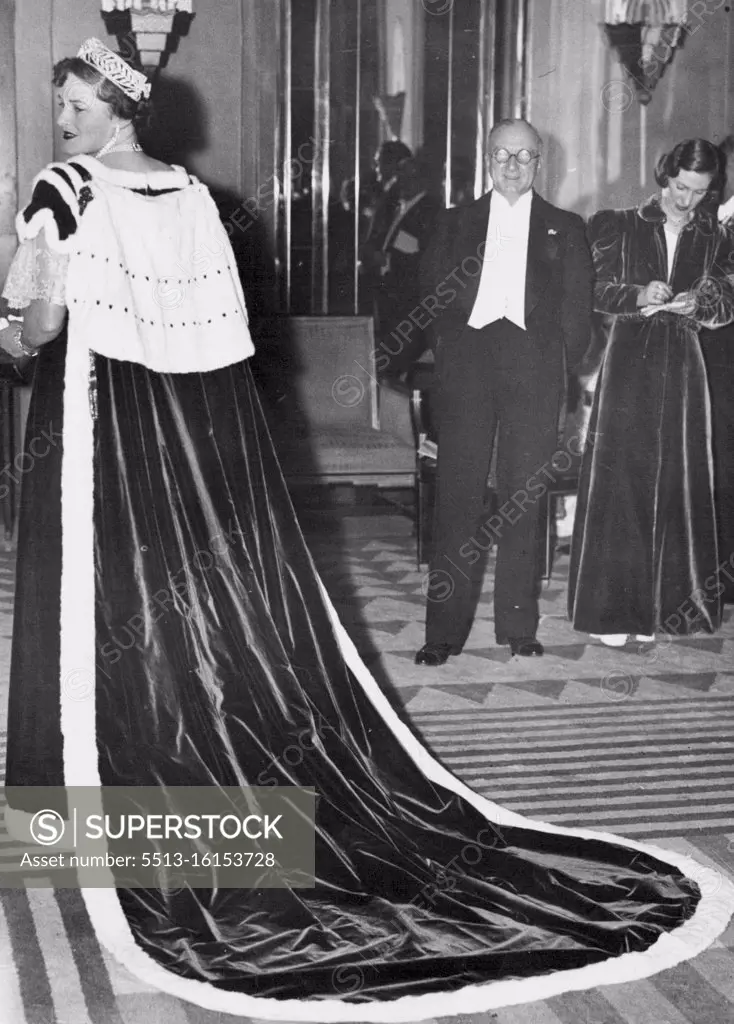 Coronation Robe -- London is coronation-minded and his coronation robe attracted much attention when worn at a charity ball, attended by the Duke and Duchess of York. November 21, 1936. (Photo by Sport & General Press Agency, Limited)