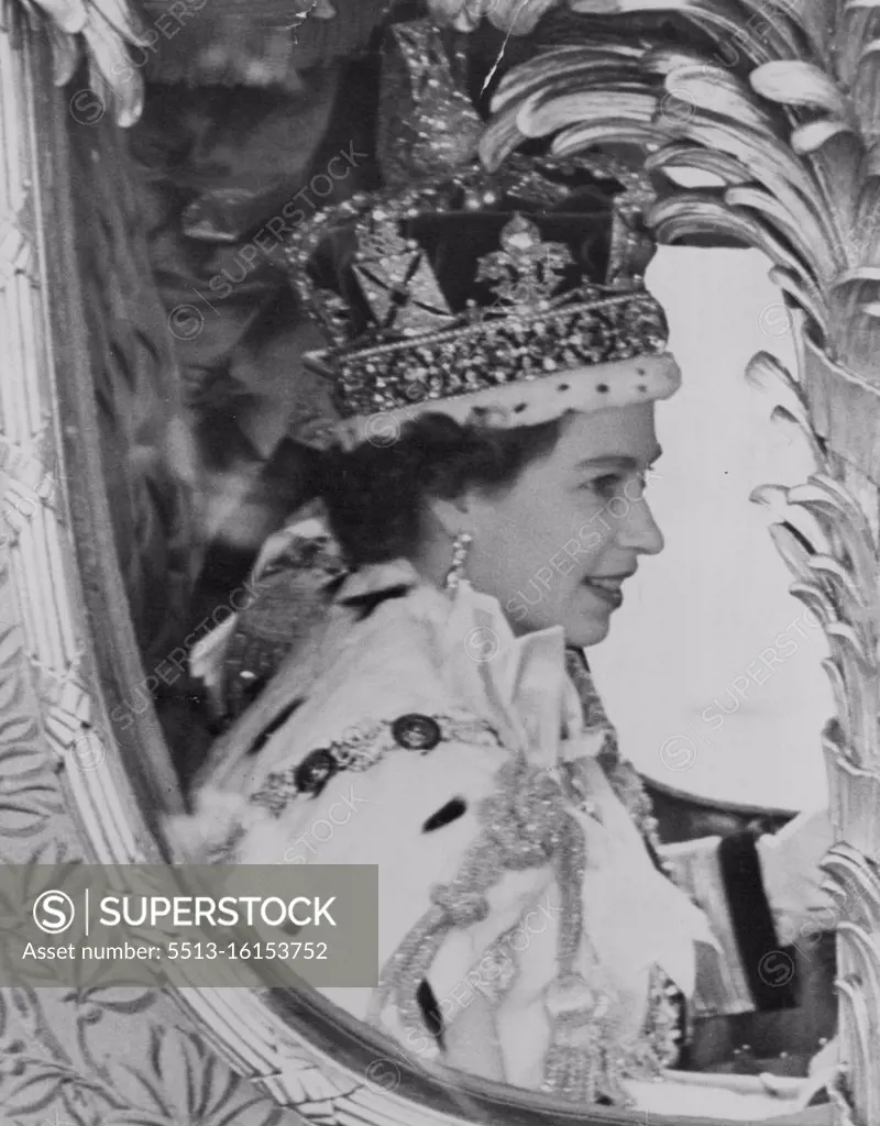 Our Smiling Queen Drives in Procession Through The Streets of London. A close-up of the newly-crowned Queen, wearing the Imperial State Crown, her sunny smile defying the grey weather, during her processional drive after her Coronation this afternoon. June 02, 1953. (Photo by Fox Photos).