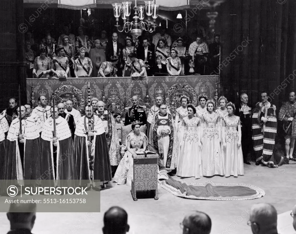The Queen takes her seat in the Chair of Estate Her Majesty the Queen photographed after making her humble adoration and ***** private prayers, sits in the Chair of Estate, just beneath the Royal Gallery in which members of the Royal Family can be seen. June 2, 1953. (Photo by Press Photo Combine)