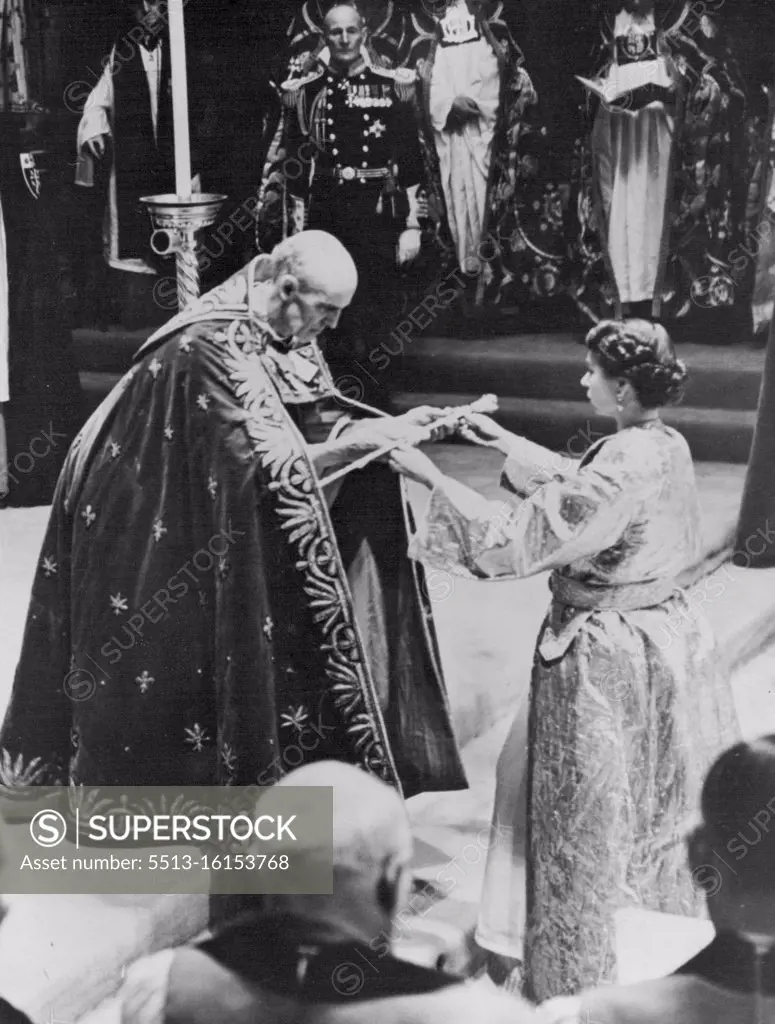 Coronation Of Queen Elizabeth II -- The Queen, dressed in the magnificent robe of cloth of gold, receives the Sceptre with cross, the ensign of Kingly power and justice, from the archbishop of Canterbury immediately prior to the crowning. January 06, 1954. (Photo by Associated Press Photo). 