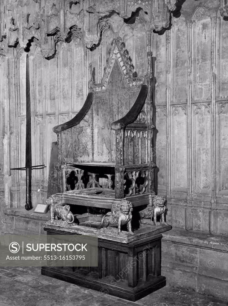 The Coronation Chair - furniture at its most architectural. ***** Chair in Westminster Abbey, which is representative of furniture at its most architectural. That chair, on which our Queen was crowned, was made by Master Walter of Durham to the order of Edward I to hold the Stone of Scone, which he brought from Scotland in 1296. It was originally brightly painted, and later gilded: seven layers of paint have been found on it. The four lions at the base were added for the coronation of Henry VIII. January 30, 1951. (Photo by Daily Mail Contract Picture).