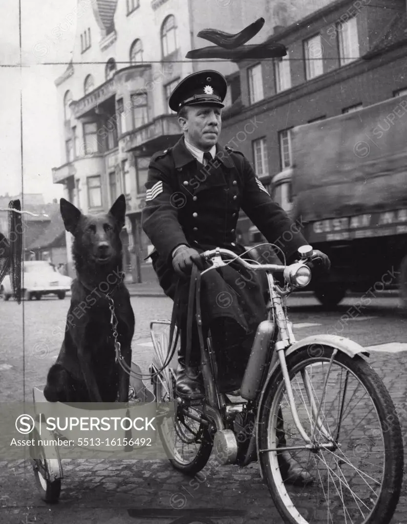 Policeman Johann Mueller, of Hamburg, Germany, with his trained police dog, Astor, which travels in his sidecar. Mueller and his dog perform patrol work. April 04, 1955. (Photo by Planet News Ltd.).