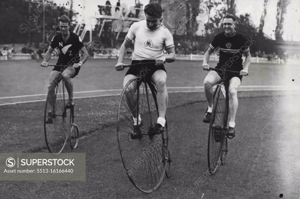 Dominion Riders Try The Old Stagers -- Sid Petterson (centre) of Australia, with A.W. Stonex and A.E. McConnell, the New Zealand riders stage an impromptu race on three of the old "Penny-farthing" cycle, during the Anniversary race meeting on the Herne Hill track, London. September 11, 1948. (Photo by Sport & General Press Agency, Limited).