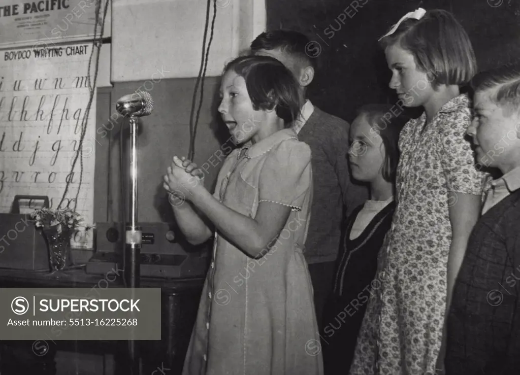 Girl reciting before an irritation microphone so as to overcome nervousness at a Mosman School. October 24, 1946.