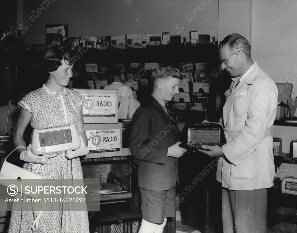 Narrabeen radio retailer Gill Alexander presents mantel radio to Virginia Carpenter and Tom Ford. Virginia, of Balgowlah, and Tom , of Northbridge, won a " best teeth " competition associated with State Health Week recently. Mr. Alexander has three children, none of whom have ever required dental treatment. " I have always been enthusiastic on teeth," he an annual said. He intends making the prizes an annual feature. November 8, 1954.
