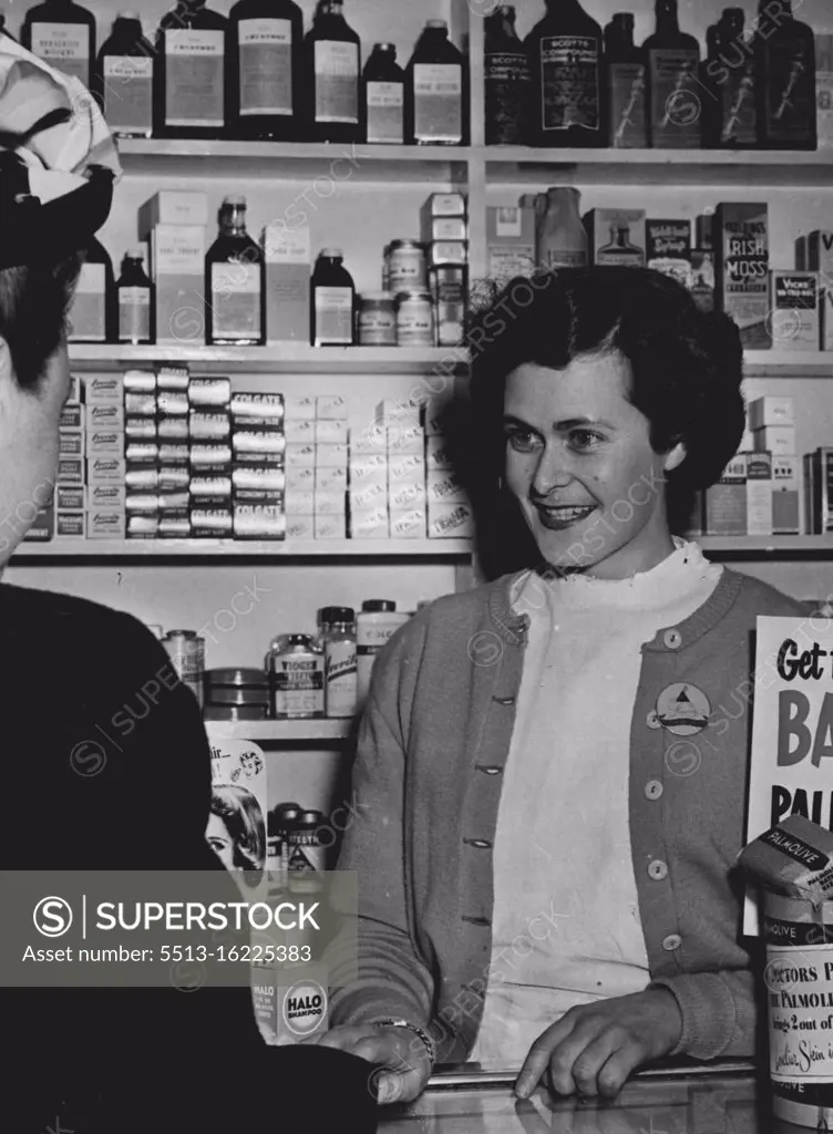 Easy Medicine To Take: Pretty twenty three years old Val. Markham who works in a Chemist shop at Kograh (NSW) dispensed herself a pleasant dose when she won all the Cop The Lot! prizes on Bob Dyer's quiz session last night over 2ve (Tuesday 29th July). Knowing Bernard and Erwin, respectively, as the Christian names of famous Generals Montgomery and Rommel copped her the lot! July 30, 1952. (Photo by Scott Polkinghorne).