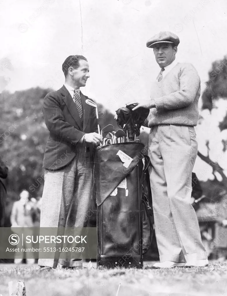 Henry Cooper, the American professional golfer, has a big task of selecting which club to use from his huge outfit, but it is nothing to the task of the caddy who has to carry it. November 19, 1934.