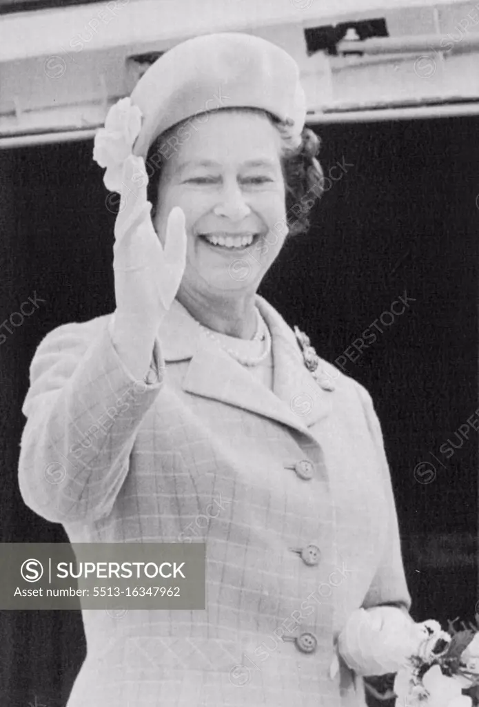 Farewell To Canada -- The Queen smiles as she waves farewell from the ramp of the Royal Air Force jet that will take her from Winnipeg to Lexington, Kentucky after completing a two week visit to Canada, Sunday. October 07, 1984. (Photo by CP Laserphoto).