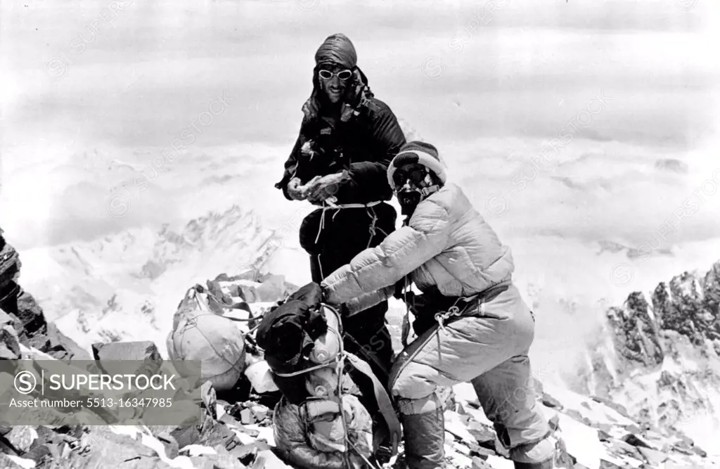 This picture of Hillary and Tensing, resting on the South Col on their descent, shows the size of the packs they carried. June 29, 1953.