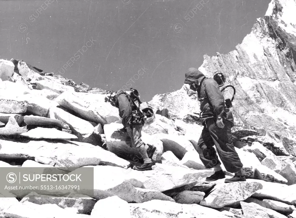 British Everest 1953 Expedition -- R.C. Evans wearing closed circuit oxygen equipment and T.D. Bourdillon wearing open circuit apparatus, climbing the South West Ridge of Amadablam at 18,500ft. May 14, 1953.
