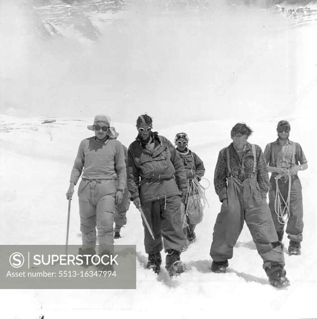 British Everest 1953 Expedition -- E.P. Hillary (second from left) with Tensing behind on their way to the camp with other members of the expedition who came up from Camp IV to meet them above the South Col. June 19, 1953. 