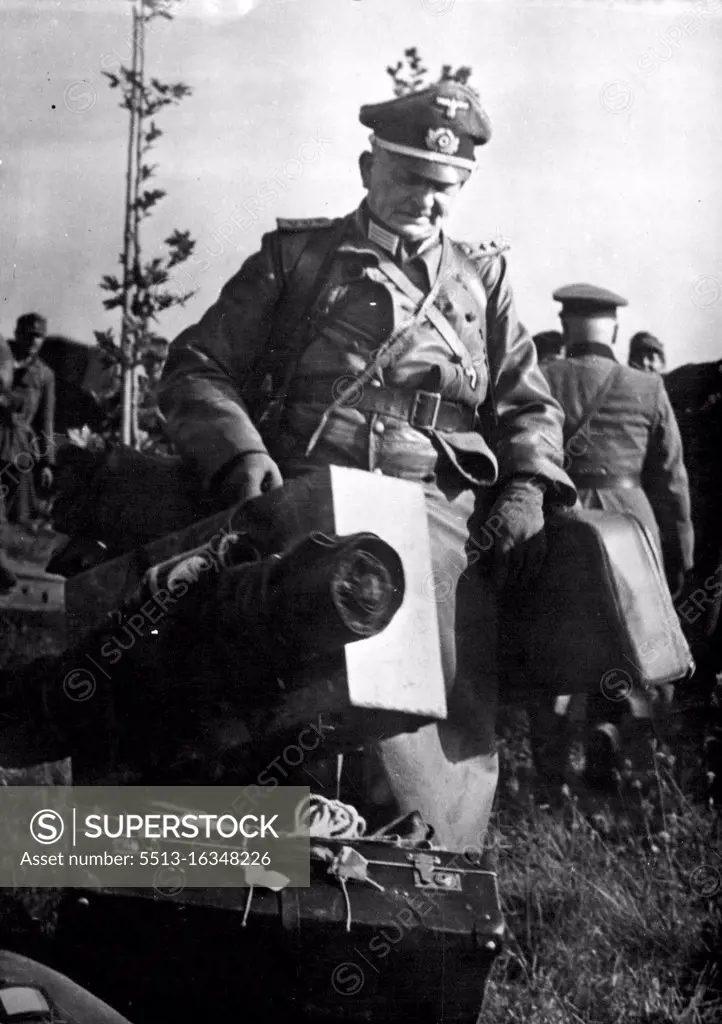 End of the Journey for a German Officer : A German officer carries his personal luggage into prison compound after his commander, Major General Erich Elster, surrounded his army of 20,000 soldiers, marines and airmen to the U.S. Ninth Army south of the Loire River in Southern France on Sept. 17, 1944. General Elster, admitting he had realized six months earlier that the war was lost for Germany, blamed the German High Command for his defeat. The Surrender, affected with full military ceremony, swelled the ranks of the more than 450,000 other enemy troops who had quit their losing battle in western Europe since the Allied landings in Normandy, on June 6. October 13, 1944. (Photo by U.S. Office of War Information).