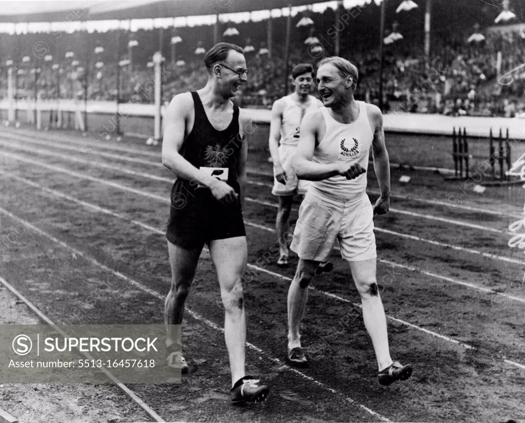 Lord Burghley, winner of the 120 yds hurdles match, talking to (left) H. trossbach berliner S.C who was second. June 27, 1932.
