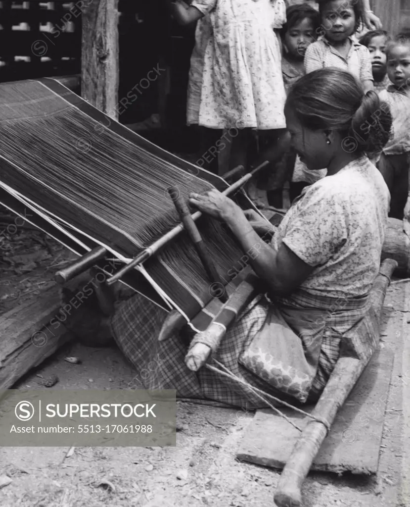 Weaving is a specialty of women in the village. Products of their looms are sold in larger villages 25 miles away through the Lush Jungles. July 8, 1955. (Photo by United Press).