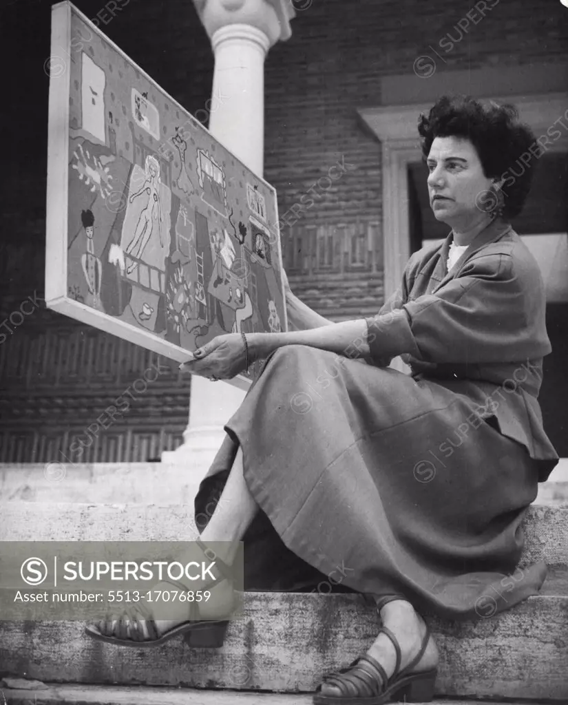 Peggy Guggenheim in Venice Mrs. Guggenheim shows also this painting of a really new conception. "Interior" is its title and the artist's name is Pageen ***** Peggy's daughter of the first marriage. January 11, 1949. (Photo by Interfoto).