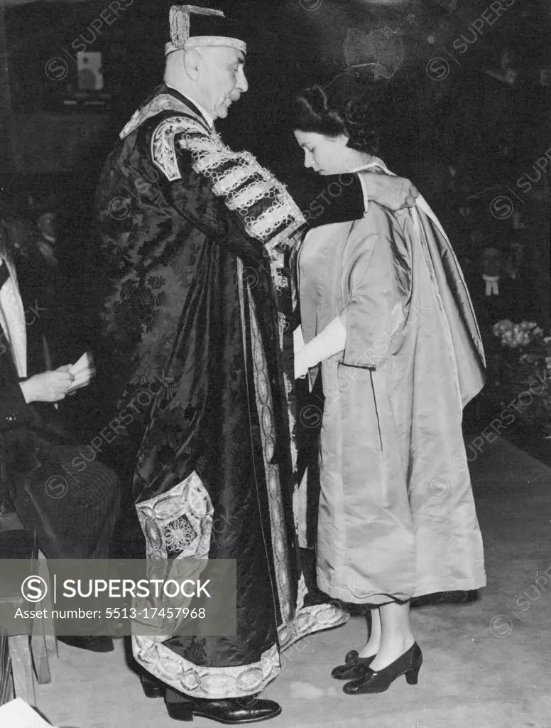 Princess Elizabeth Receives Degree at London University -- The Earl of Athlone, Chancellor of the University, placing the hood of Bachelor of Music over the gown of Princess Elizabeth as he conferred the degree. Princess Elizabeth, elder daughter of the King and Queen, received the degree of Bachelor of Music at a ceremony in the Senate House of London University at which the Chancellor of the University, the Earl of Athlone, great-uncle of the Princess, officiated. Music is one of the Princess greatest interests. July 10, 1946. 