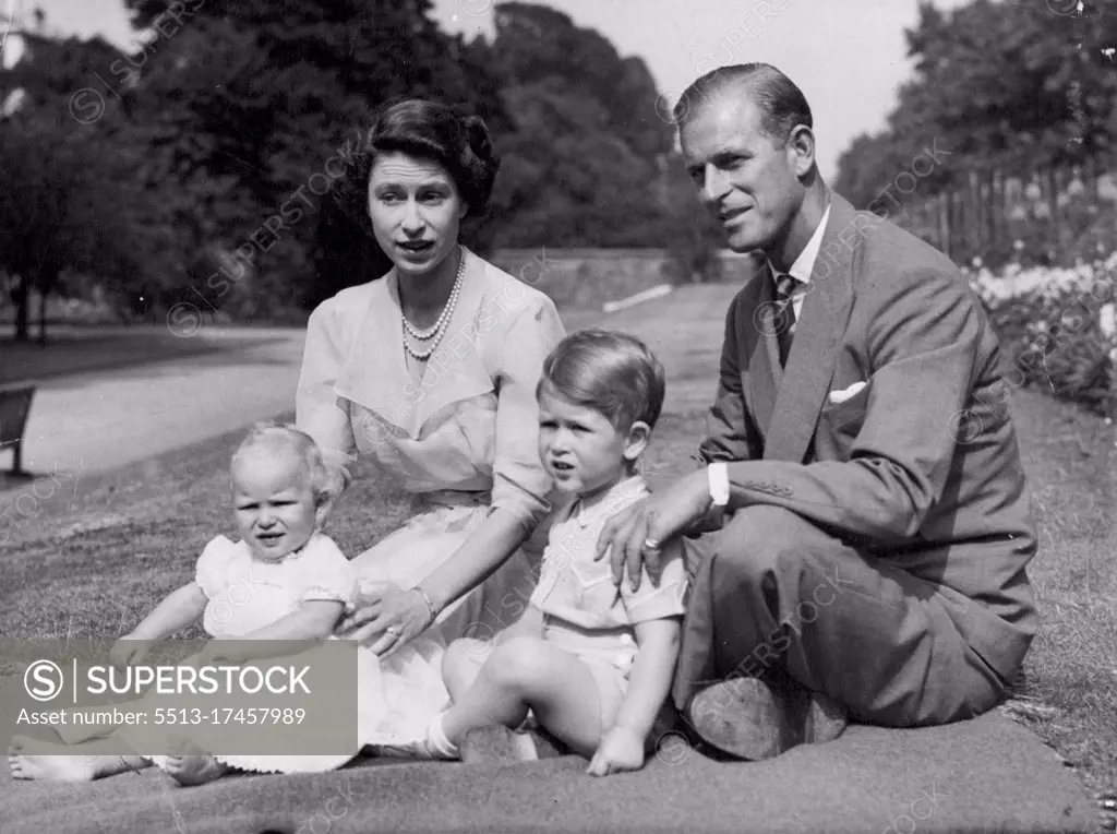 Happy Family At Clarence House -- The Happy family in the garden of their London home. These photos HRH Princess Elizabeth with Her Husband, The Duke of Edinburgh, and their children, Princess Charles (Born 14 November 1948). and Princess Anne (Born 15 August 1950) were made recently in garden of the Royal couple's London residence at Clarence house. Elizabeth and Philip must be ideal parents, devoted to their Royal Duties - and still live a full public life. May 15, 1953.
