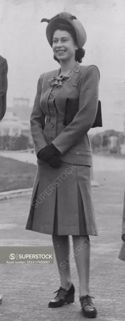 Princess Margaret Flies To N. Ireland - H.R.H. Princess Elizabeth wore a pale sapegreen suit and hare hat to match, with brown accessories when she said goodbye to Princess Margaret at London Airport to-day (Tuesday). The panelled jacket had an unusual false-bolero effect and the pleated skirt showed no tendency towards the recently announced "London Line". H.R.H. Princess Margaret left London Airport by air for Northern Ireland this afternoon (Tuesday), and was bid farewell at the Airport by her sister H.R.H. Princess Elizabeth. October 14, 1947. 