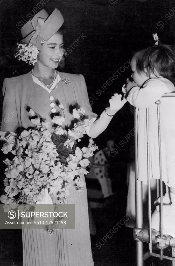 Valerie Meets The Princess -- Princess Elizabeth visited the Queen Elizabeth Hospital for Children, Hackney, East London, Yesterday, and chatted and ***** to 125 children before presiding ***** annual Court of Governors. ***** Valerie, patient at the Queen ***** Hospital, stands up in her ***** a chat with Princess Elizabeth. May 23, 1947.