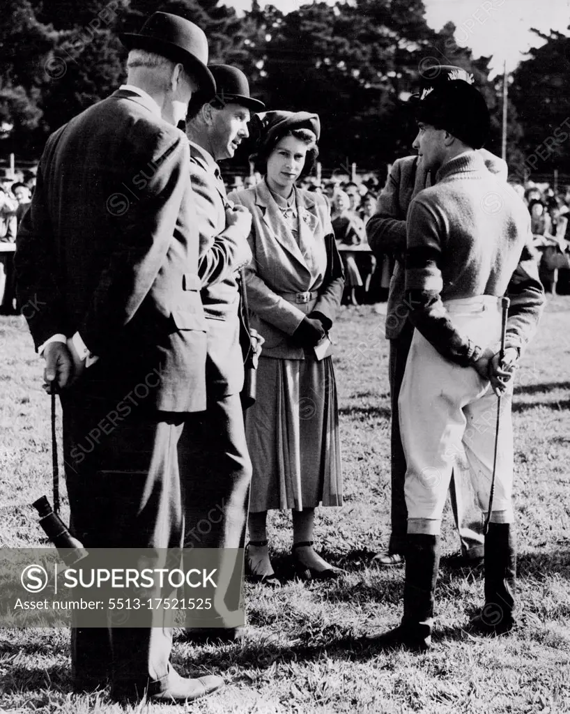 Princess Has A word With Her Jockey - Princess Elizabeth talking with her jockey A. Grantham, at Fontwell-Park today. Standing next to the Princess on left is Monaveen's trainer, Peter Cazalet. Princess Elizabeth was at Fontwell Park to-day (Monday) to watch Monaveen, the Grand National candidate which she owns in partnership with the Queen, win the Chichester Handicap Chase - his first outing in his new colours. Monaveen, ridden by A. Grantham, defeated Random Knight (second) and Mart in M (third ). The Princess had returned earlier in the day from Balmoral after the Royal Family's holiday. October 10, 1949. (Photo by Reuterphoto).