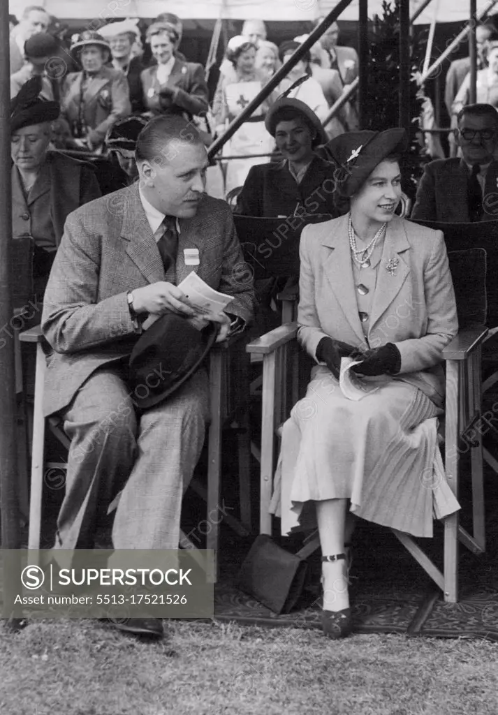 The Royal Windsor Horse Show - Princess Elizabeth watching the judging. Beside her is Mr. Geoffrey Cross. H.R.H. Princess Elizabeth and the Duke of Edinburgh were present at the Royal Windsor Horseshow, which opened beside Windsor Castle today. May 12, 1949. (Photo by Fox Photos).