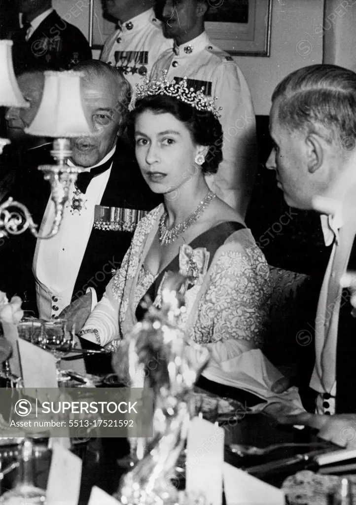 Queen Dines Aboard H.M.S. Vanguard -- Her Majesty dining aboard H.M.S. Vanguard last night. After the review at Spithead last night her Majesty the Queen Dined aboard H.M.S. Vanguard, the only battleship in the review. June 16, 1953. (Photo by Paul Popper Ltd.).